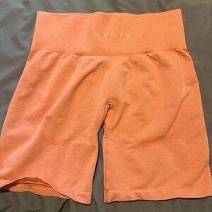 Peachy Orange NVGTN Workout Shorts